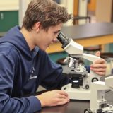boy-using-microscope